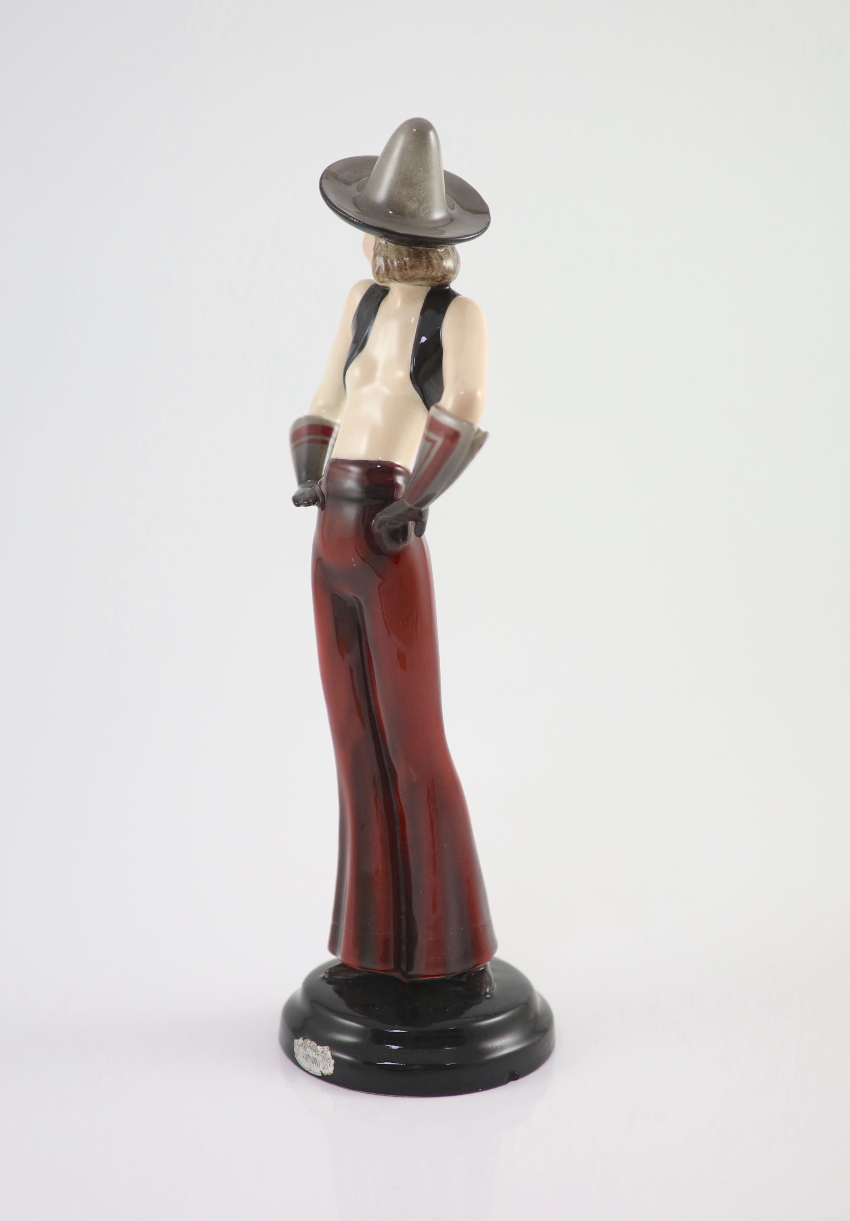 Stefan Dakon for Goldscheider, an Art Deco pottery figure of a girl wearing a Sombrero, c.1935, 30.5cm high